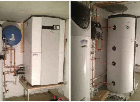 Moderne Luftwärmepumpe mit Pufferspeicher und Heizungsinstallation im Keller.